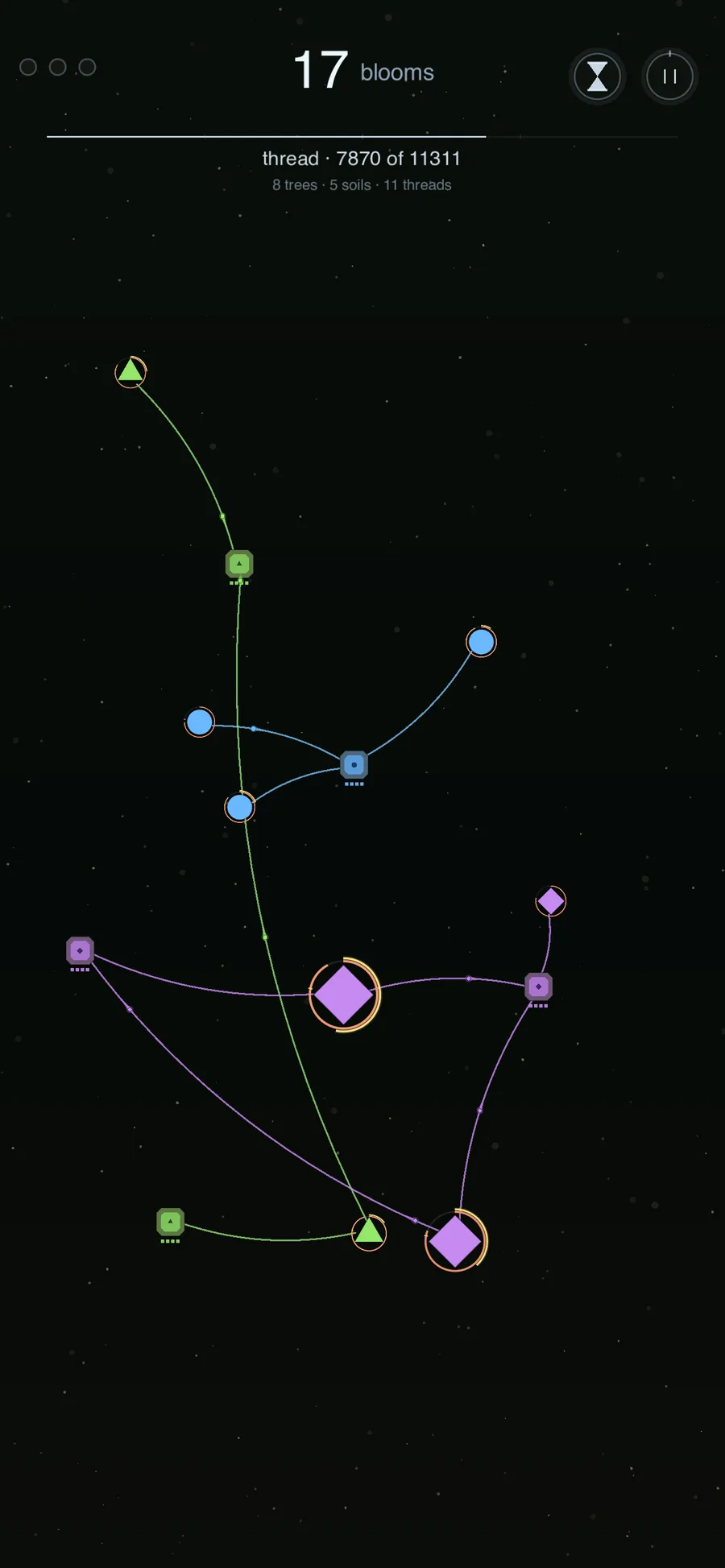 Mid-game view with soil cubes connected to blooming trees via colored threads